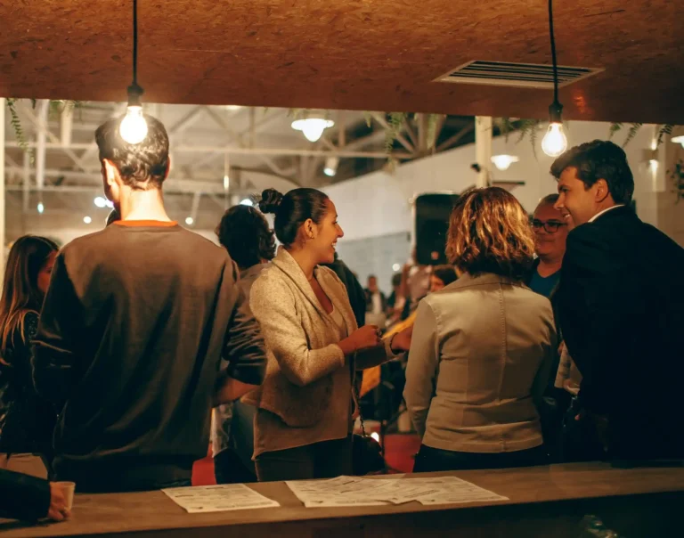 People gathered at a conference network within their cybersecurity association.